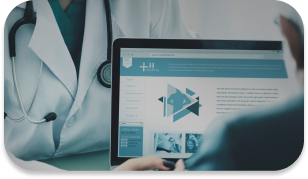 A doctor explaing the healthcare plans on a laptop.